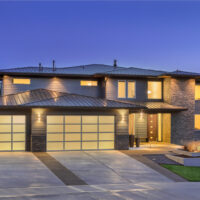 Front elevation of luxury home in evening